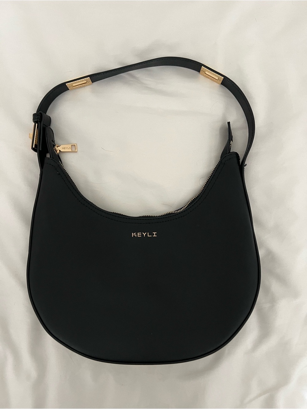 Keyli Black Crescent Shoulder Bag with Gold Accents
